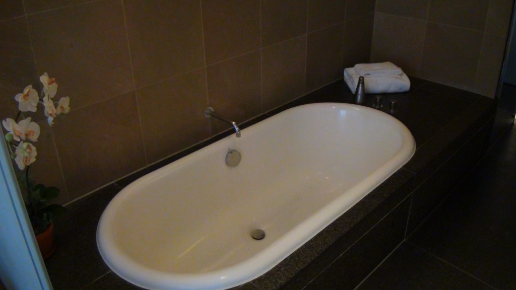 a white bathtub in a bathroom
