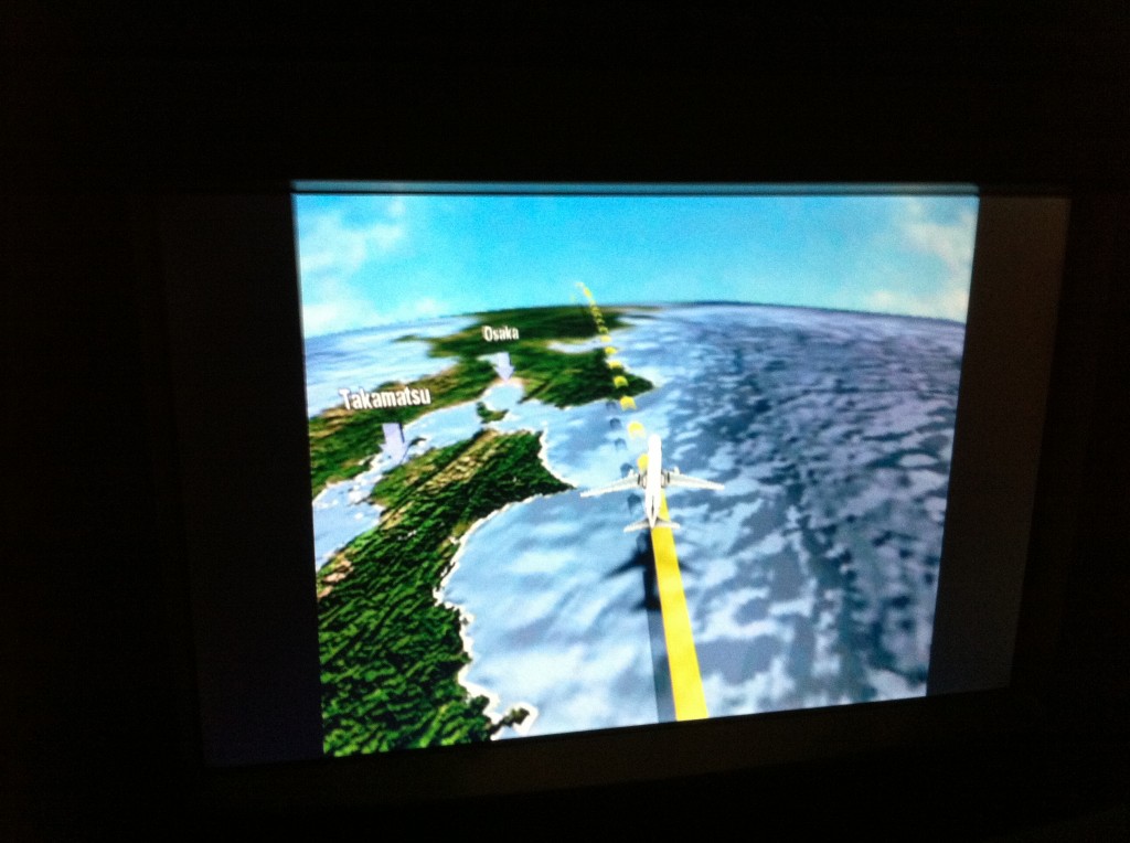 a video game screen showing a plane flying over the ocean