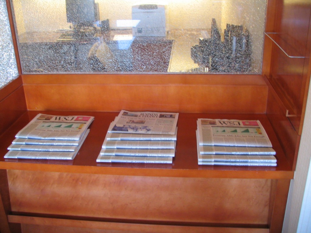 a shelf with several magazines on it