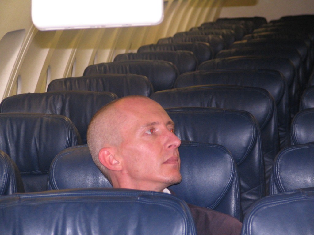 a man sitting in an airplane seat
