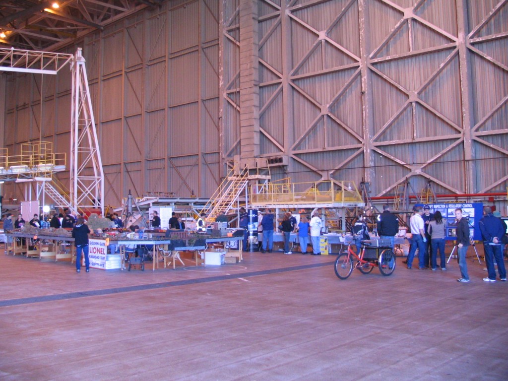 a group of people in a large hangar