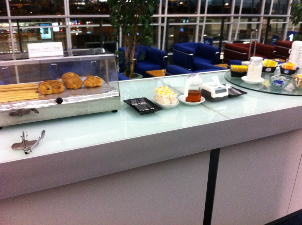 a counter with pastries and other items on it