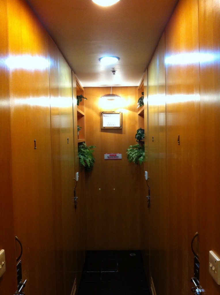 a hallway with cabinets and plants