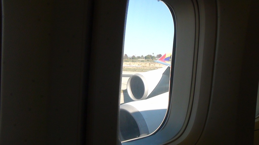 a window with a plane wing