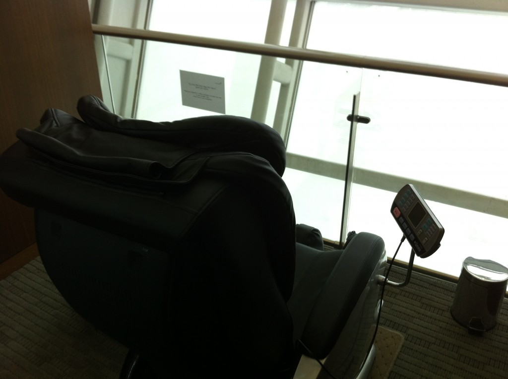a black chair with a device attached to it
