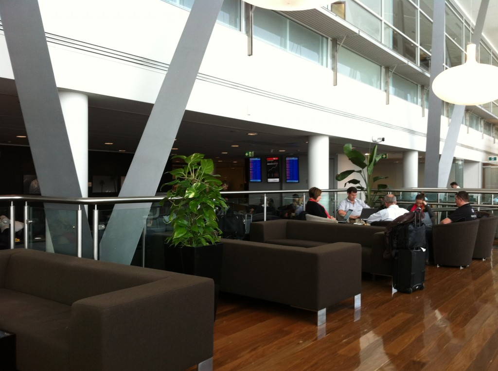 people sitting in a lobby of a building