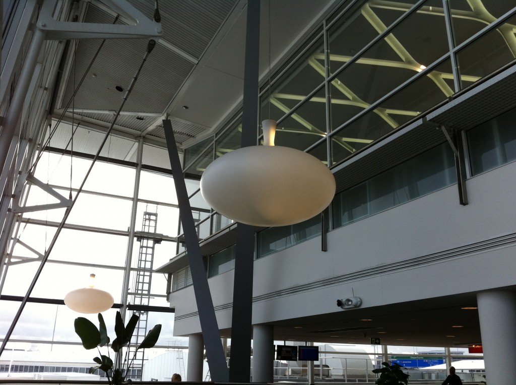 a large white light fixture in a building