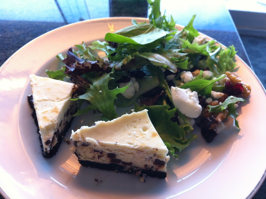 a plate of salad and cheesecake
