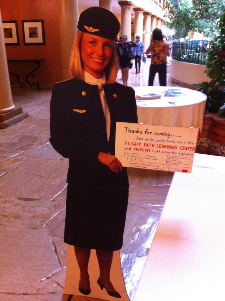 a cardboard cutout of a woman holding a sign