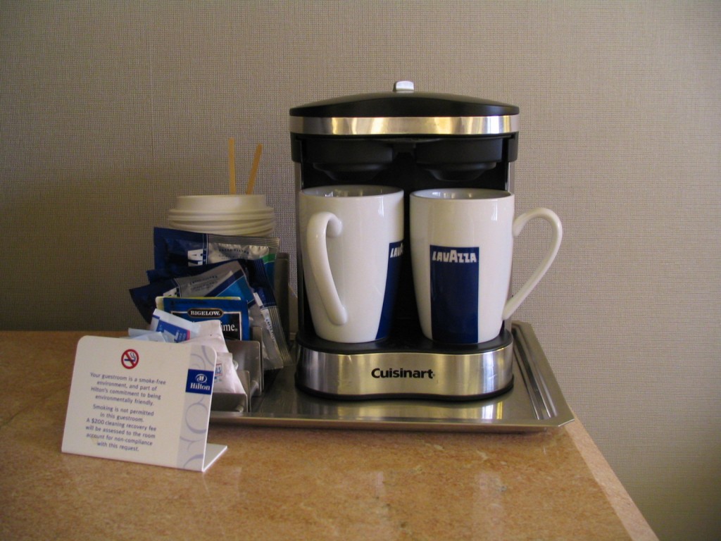 a coffee maker with two cups