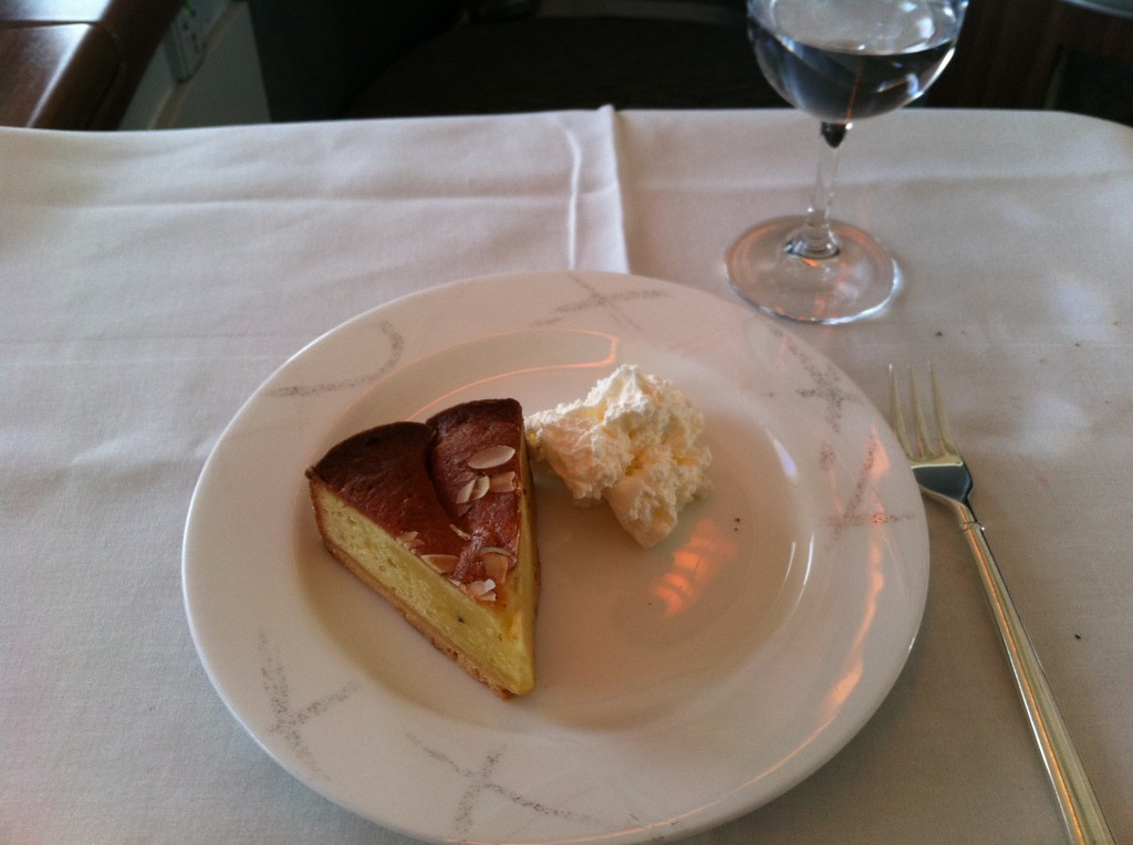 a slice of cake and a glass of water