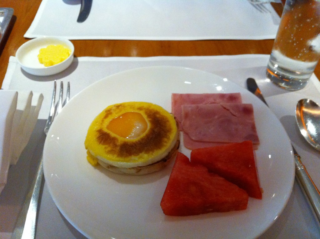 a plate of food with a egg and watermelon