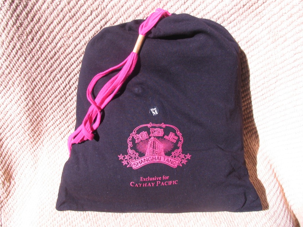 a black bag with pink string
