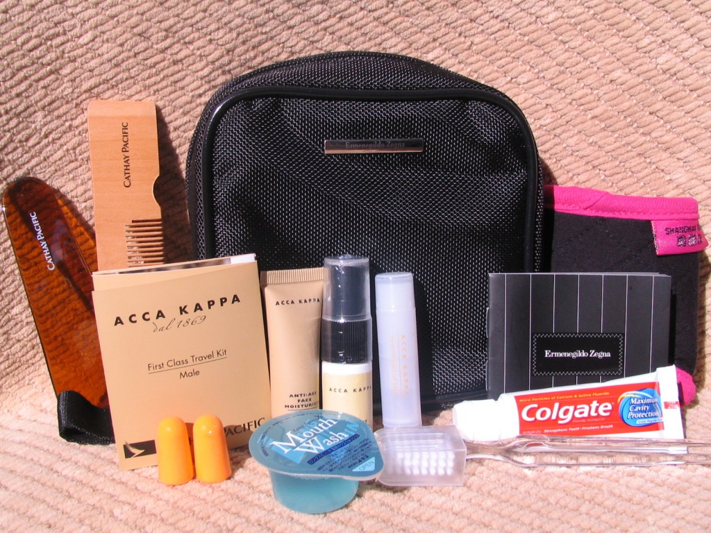 a small black bag with a variety of items on it
