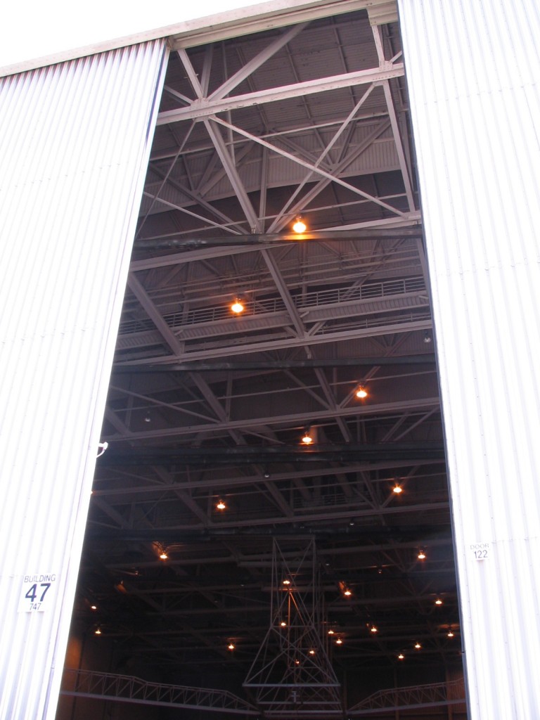 a large metal building with a large open door