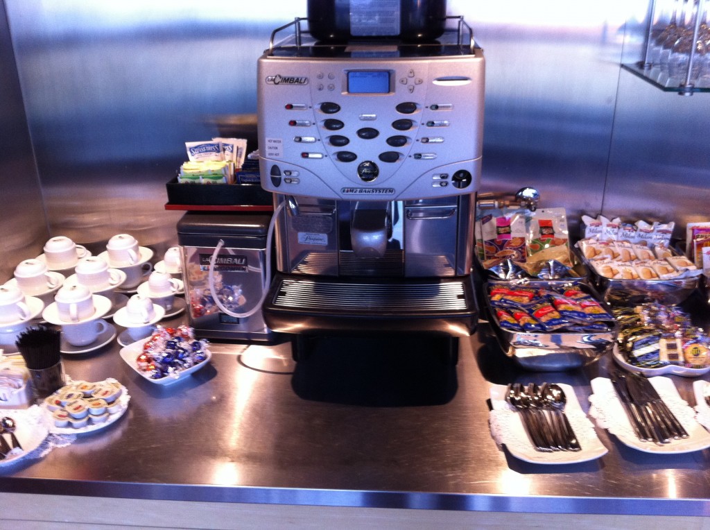 a coffee machine with a variety of food on the counter