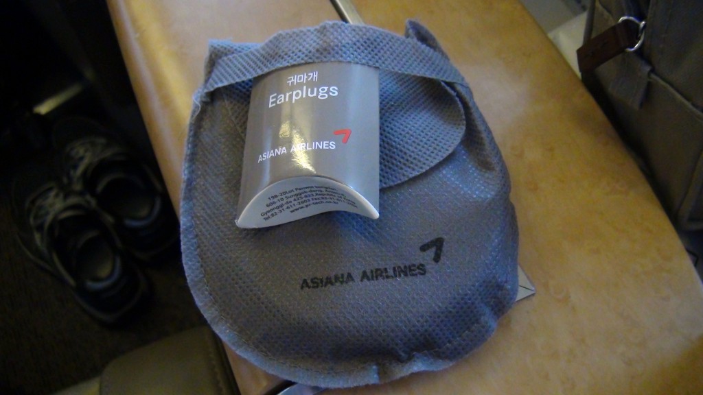 a small grey bag with a white label on it