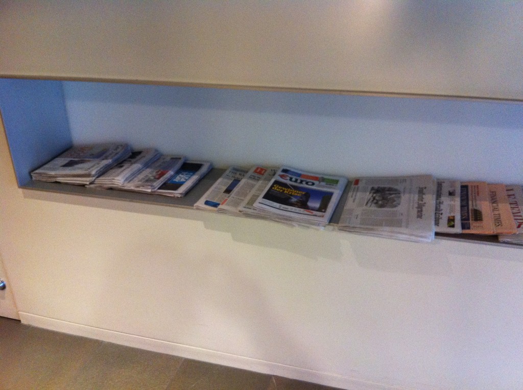 a shelf with newspapers on it