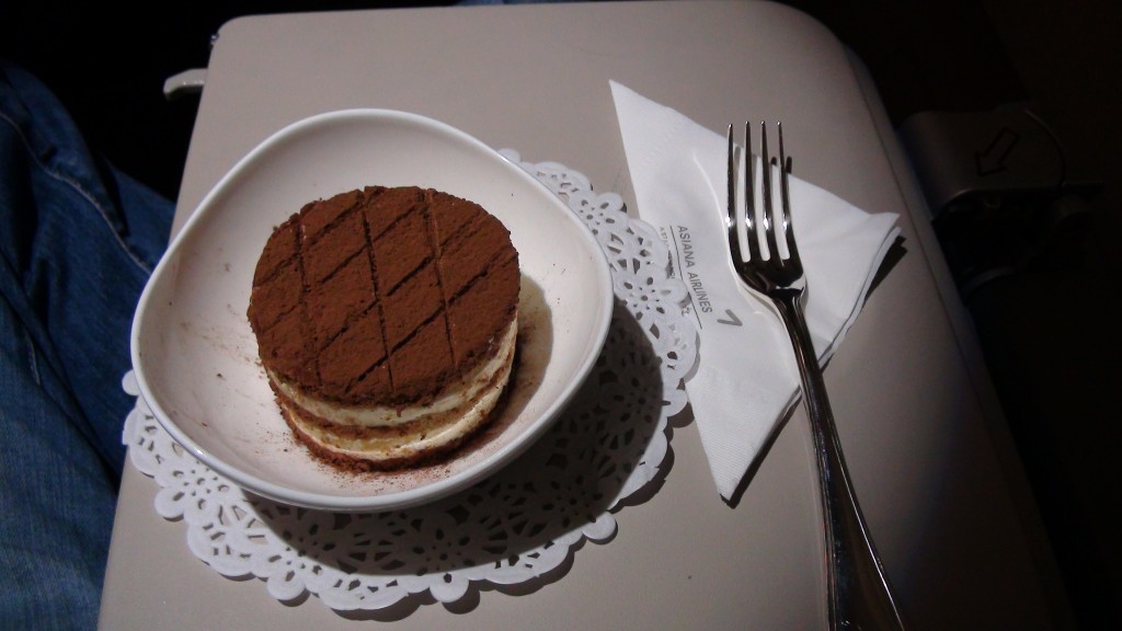 a plate of dessert with a fork and napkin
