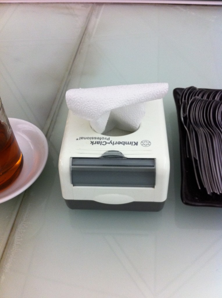 a tissue box with a napkin on top