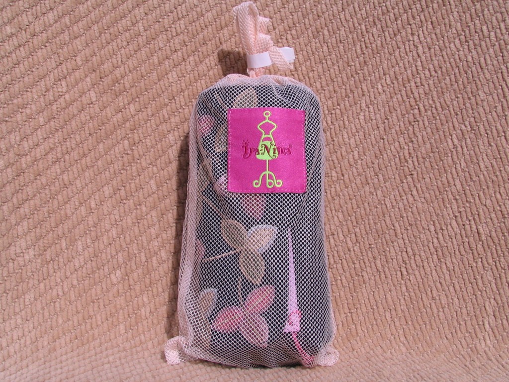 a small bag with a pink and white butterfly design on it