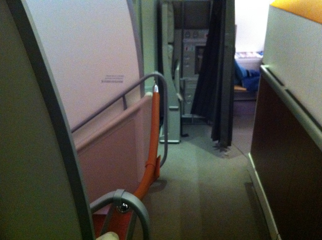an airplane with a door and a chair