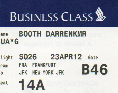 a close-up of a business class ticket