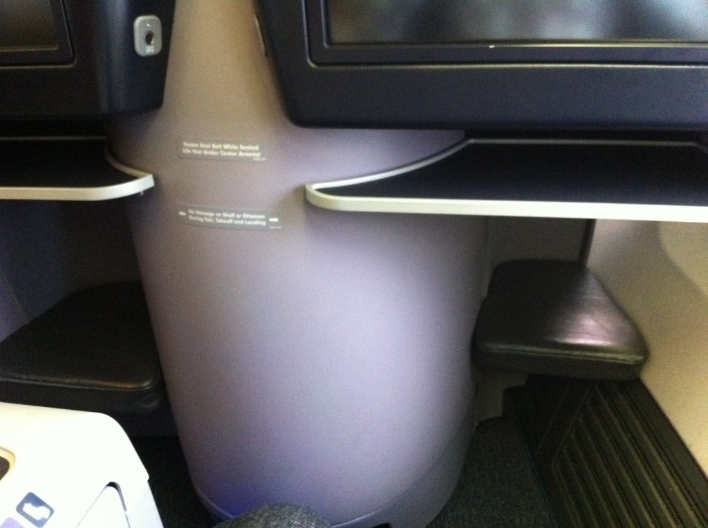 a large white object with a black seat