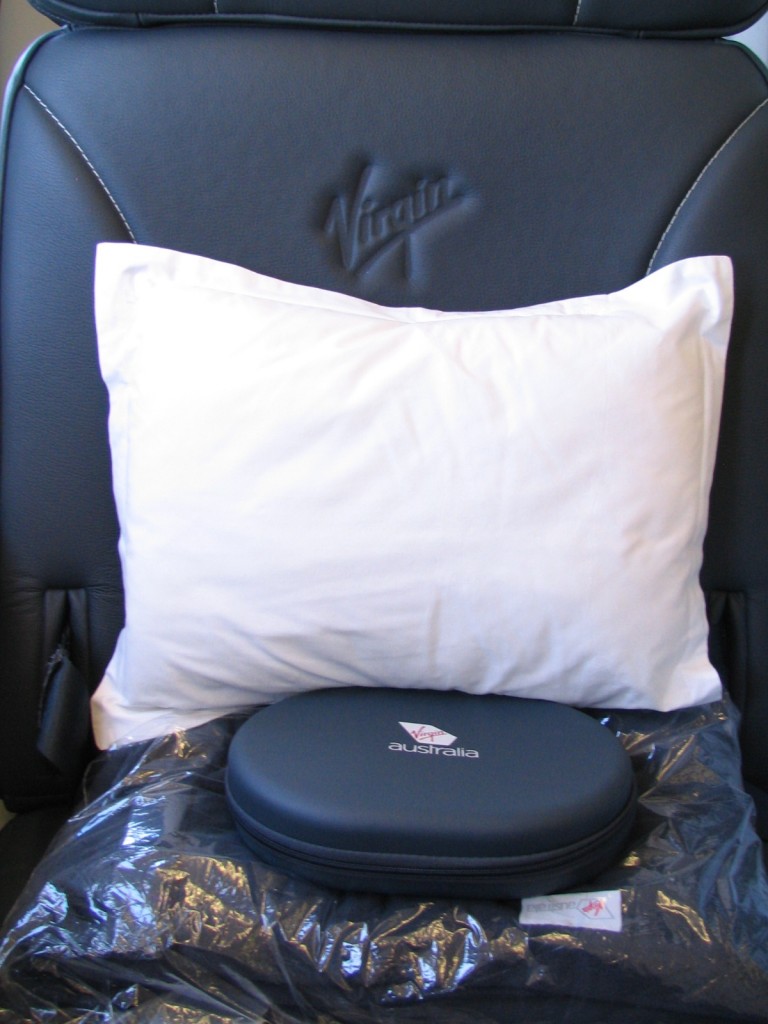 a white pillow and a case on a chair