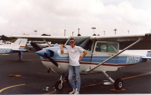 a man standing next to a small plane