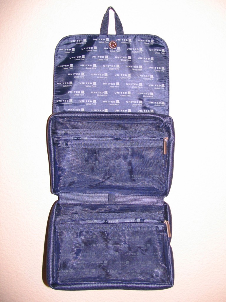 a blue bag with zippers