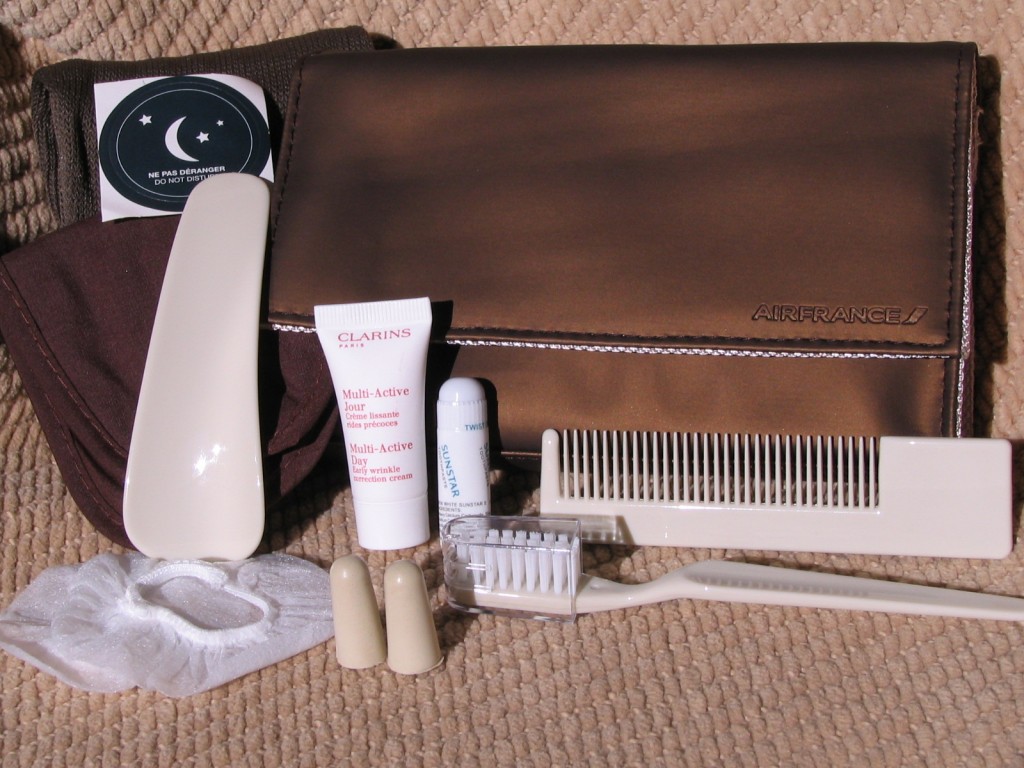 a brown bag with a white comb and toothbrushes
