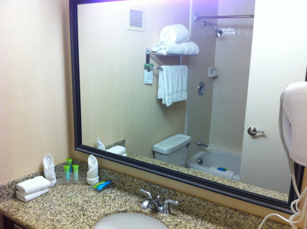 a bathroom with a large mirror