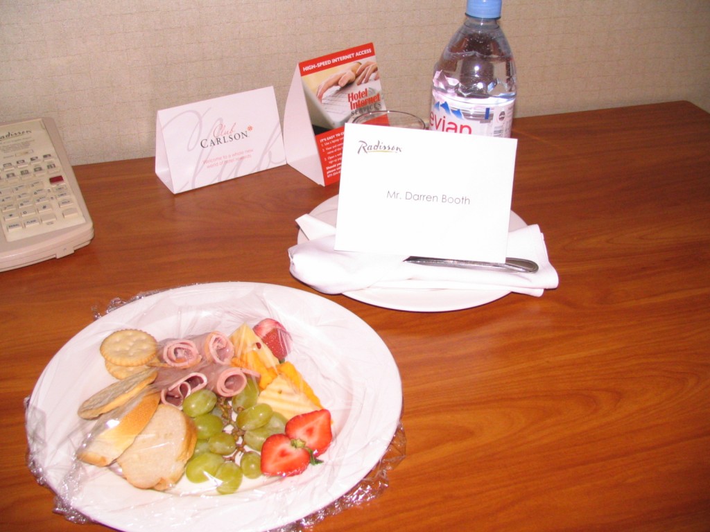 a plate of food and a water bottle on a table