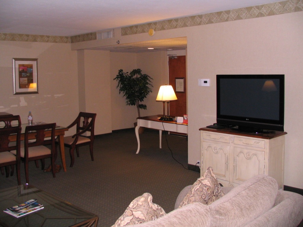 a living room with a television and a table