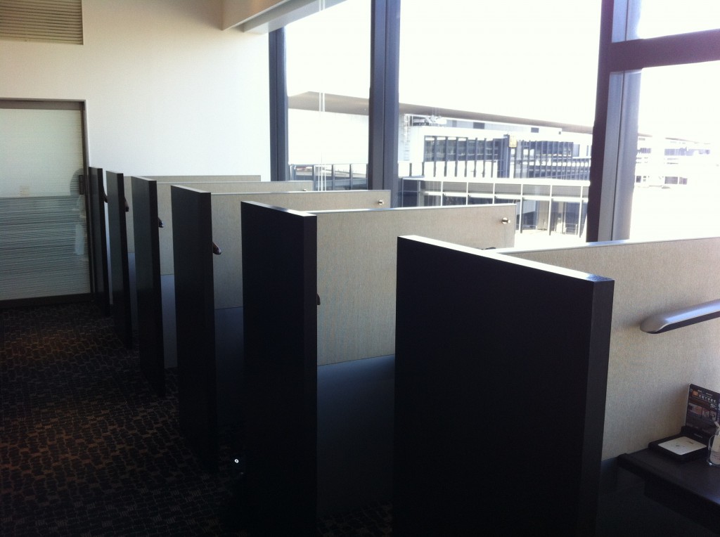 cubic cubicles in a room with windows