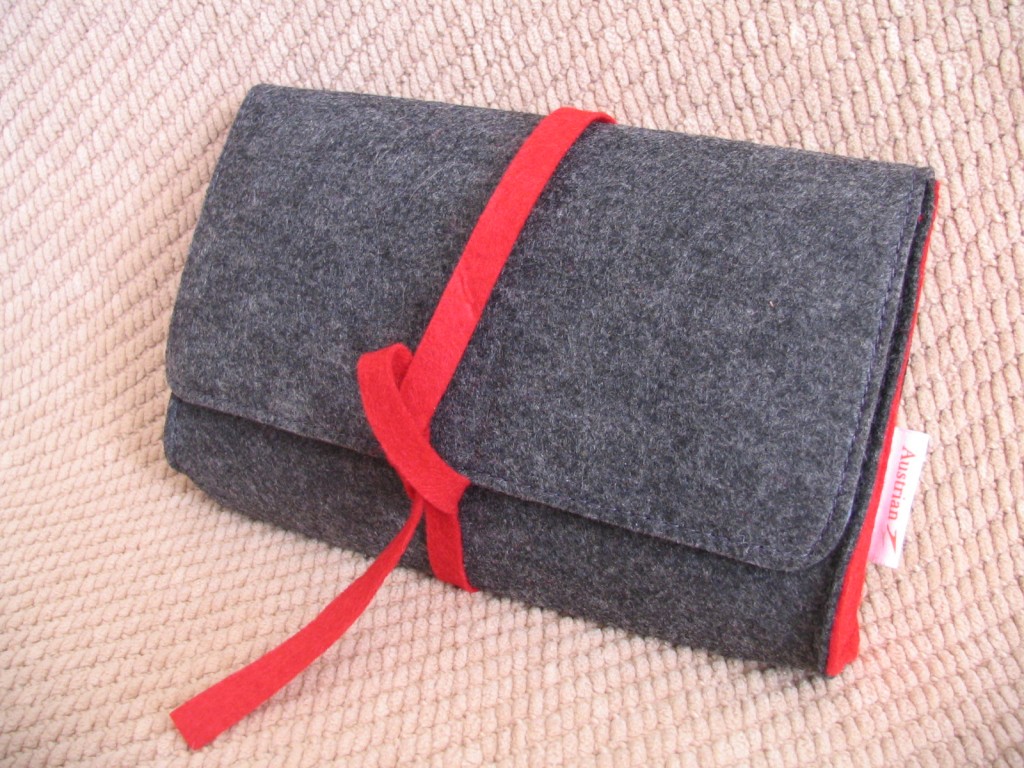 a grey and red felt pouch