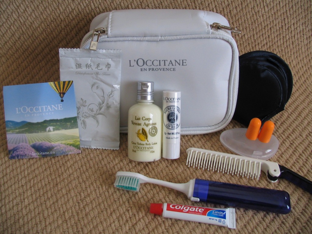 a small white bag with a variety of items on it