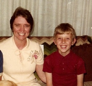 a woman and a boy sitting on a couch