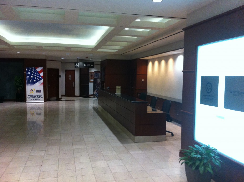 a lobby with a sign and a desk