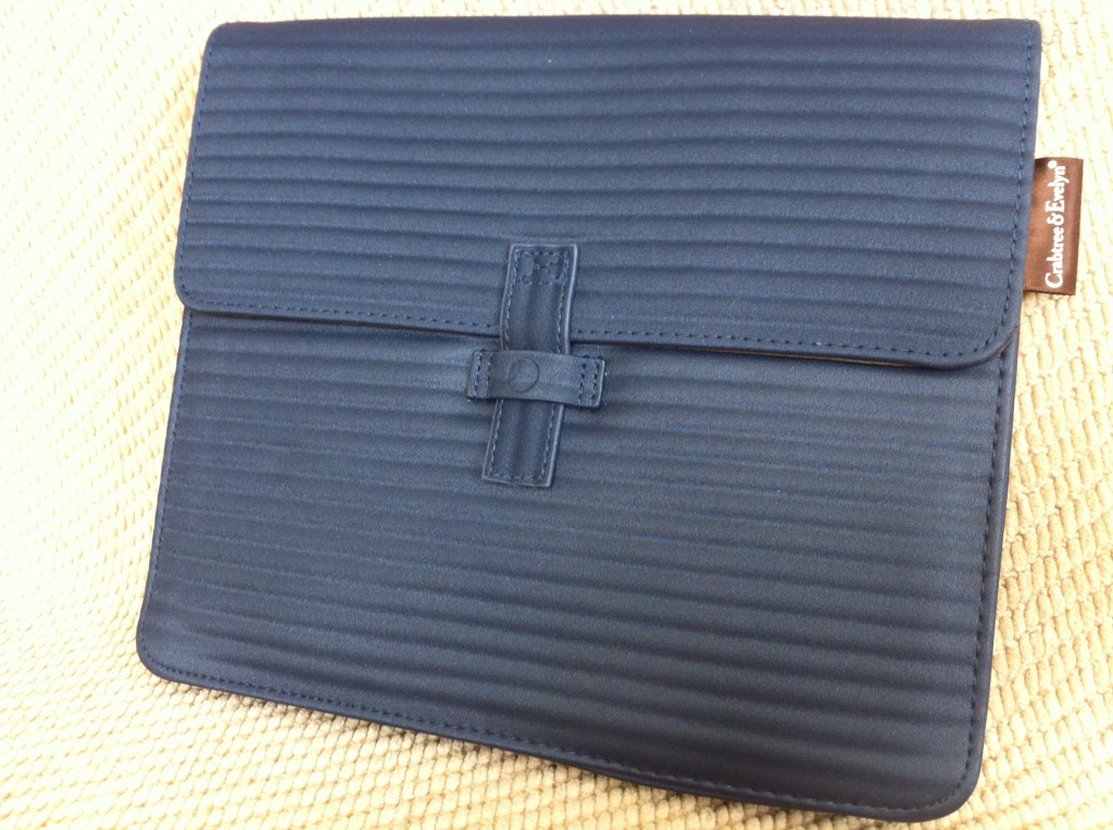 a black leather wallet on a yellow surface
