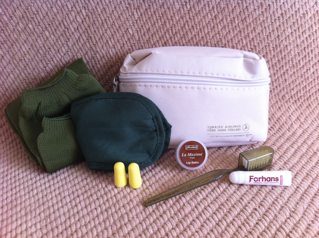 a small white bag with earplugs and a small white bag with earplugs and a small white bag with earplugs and a small white bag with earplugs