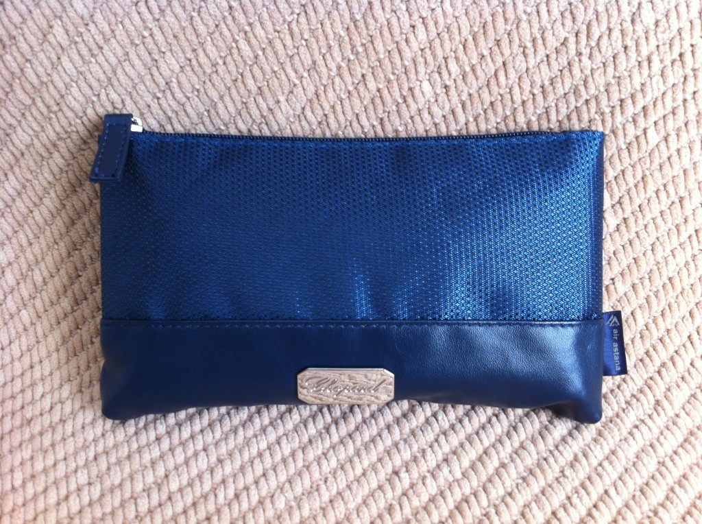 a blue pouch on a tan surface