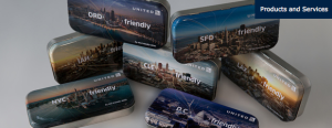 a group of tins with images of a city